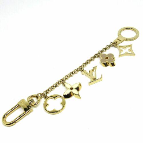 LOUIS VUITTON Bag Charm Chain Fleur De Monogram Gold Cream: LOUIS VUITTON Bag Charm Chain Fleur De Monogram Gold Cream Brand: LOUIS VUITTON Style: Bag Charm Color: Gold Cream PinkBeige Material: Hardware Model Number: M65111 Product Name: Bag Charm Chain Fleur