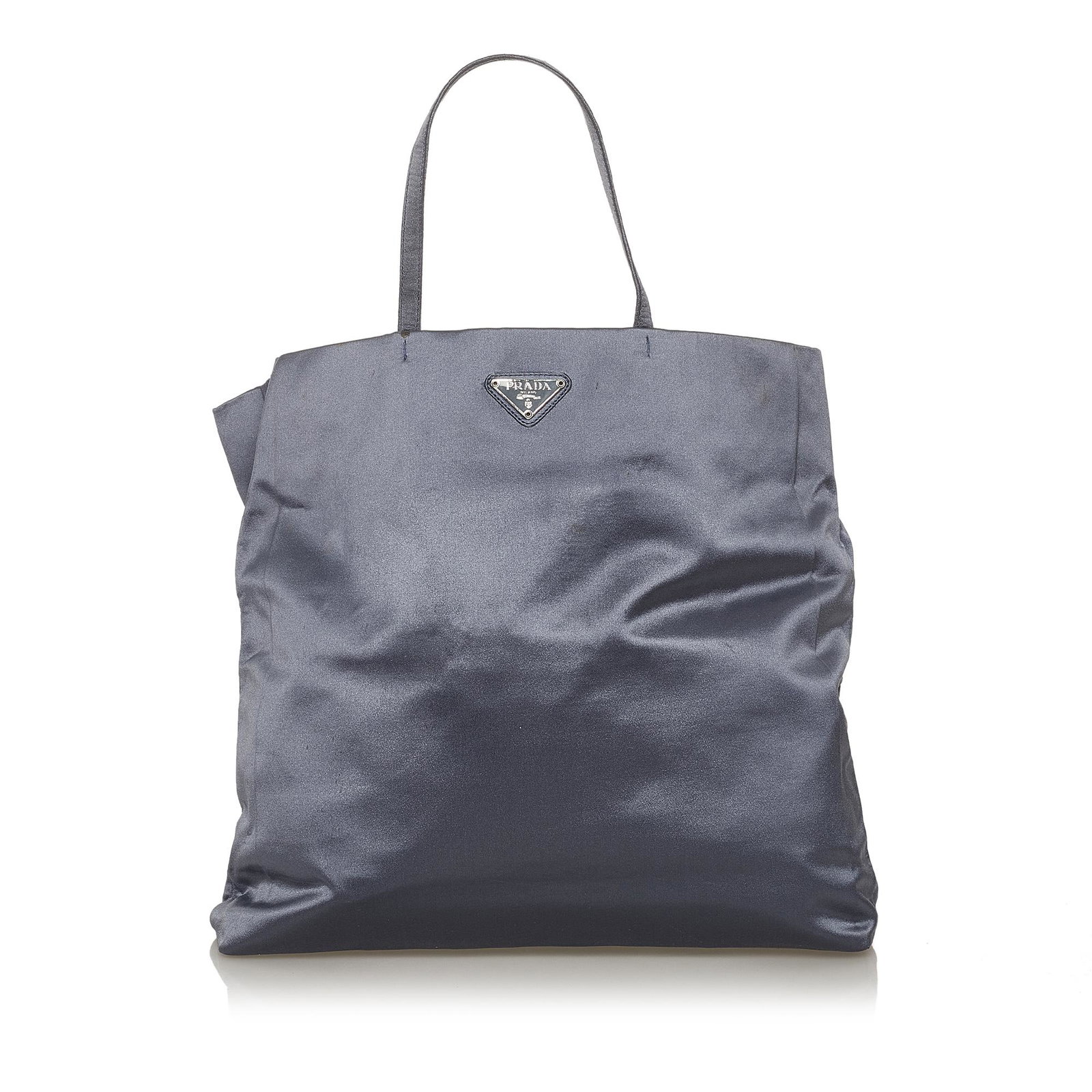 Prada Tessuto Tote Bag: Prada Tessuto Tote Bag This tote bag features a nylon body rolled handles a top zip closure and an interior zip pocket. Brand: Prada Model: Tessuto Tote Bag Origin: Italy Category: Bags Color: Blue St