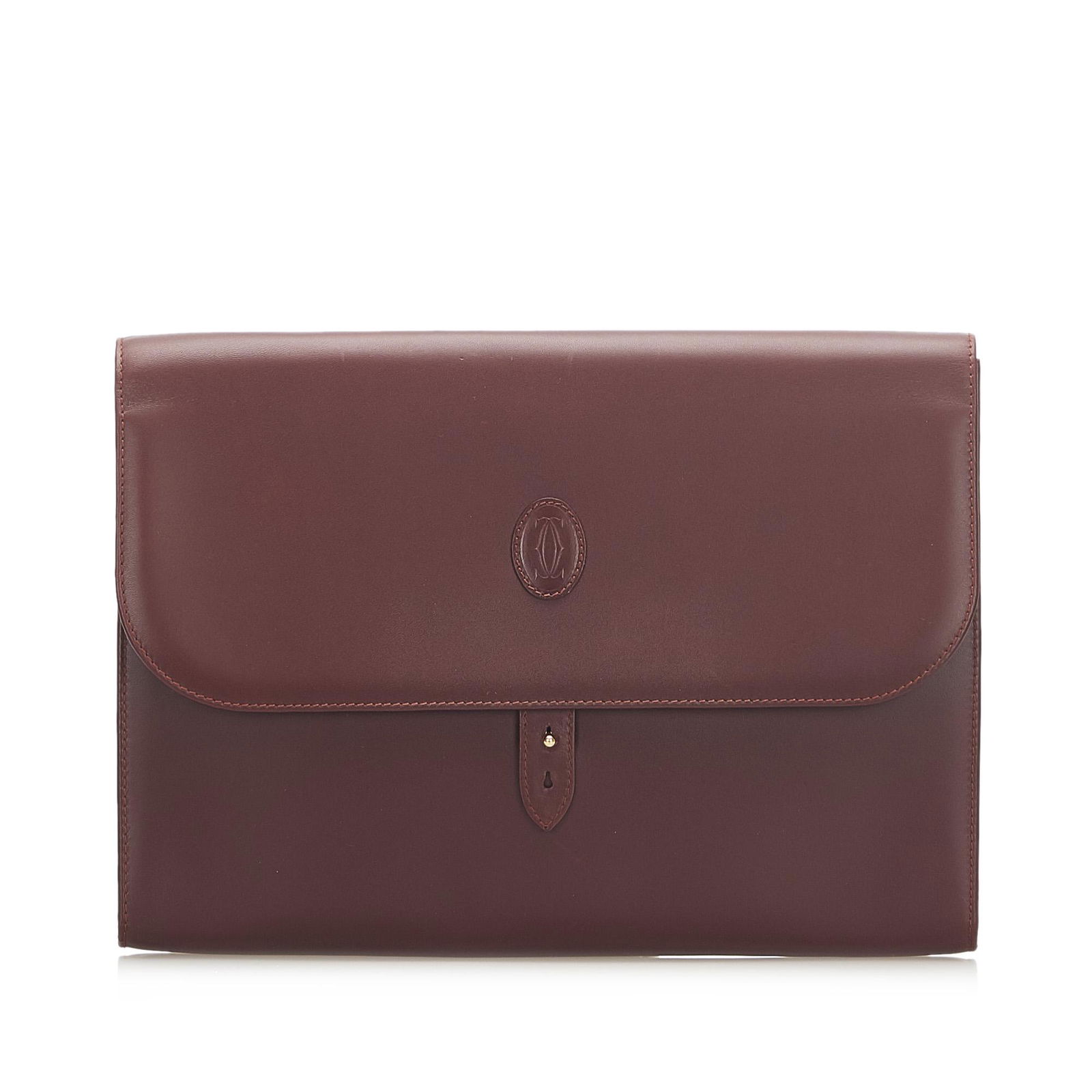 Must de Cartier Leather Clutch: Must de Cartier Leather Clutch The Must De Cartier clutch bag features a leather body and a front flap with a hook closure. Brand: Cartier Model: Must de Cartier Leather Clutch Origin: France Category