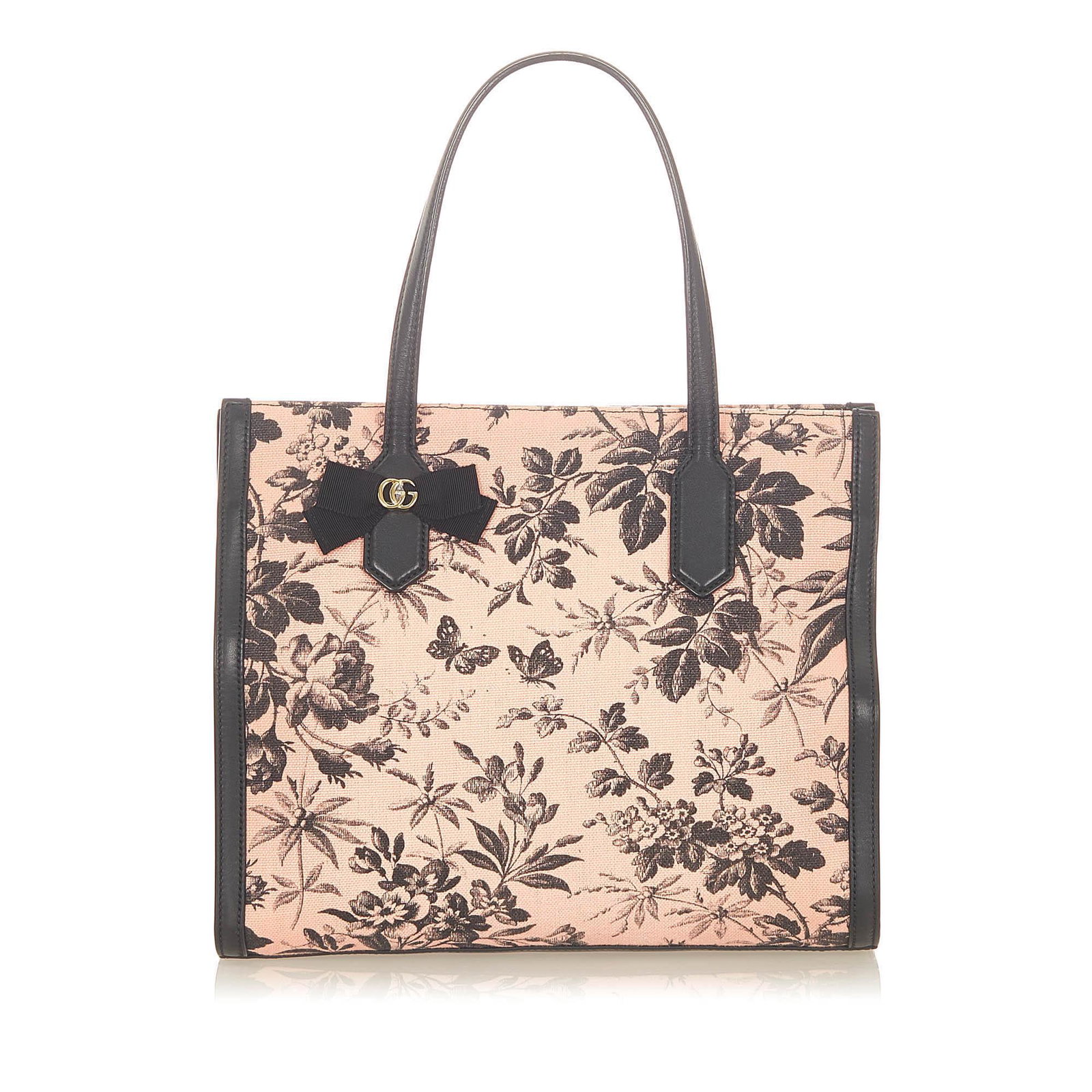 Gucci Herbarium Canvas Tote Bag: Gucci Herbarium Canvas Tote Bag This tote bag features a floral canvas body with leather trim flat leather handles an open top with a magnetic closure and interior slip pockets. Brand: Gucci Model: He