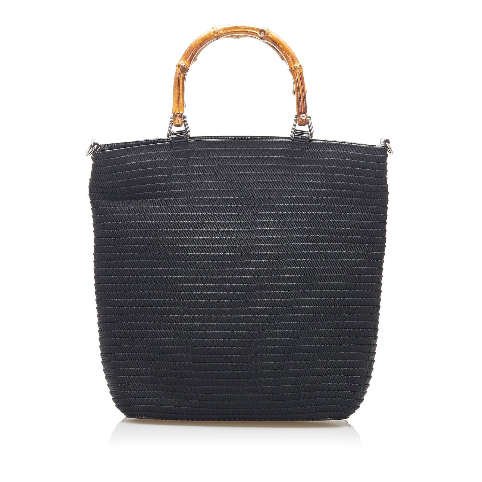 Gucci Bamboo Canvas Handbag: Gucci Bamboo Canvas Handbag This handbag features a canvas body bamboo handles a detachable flat strap a top zip closure and an interior zip pocket. Brand: Gucci Model: Bamboo Canvas Handbag Origin: I
