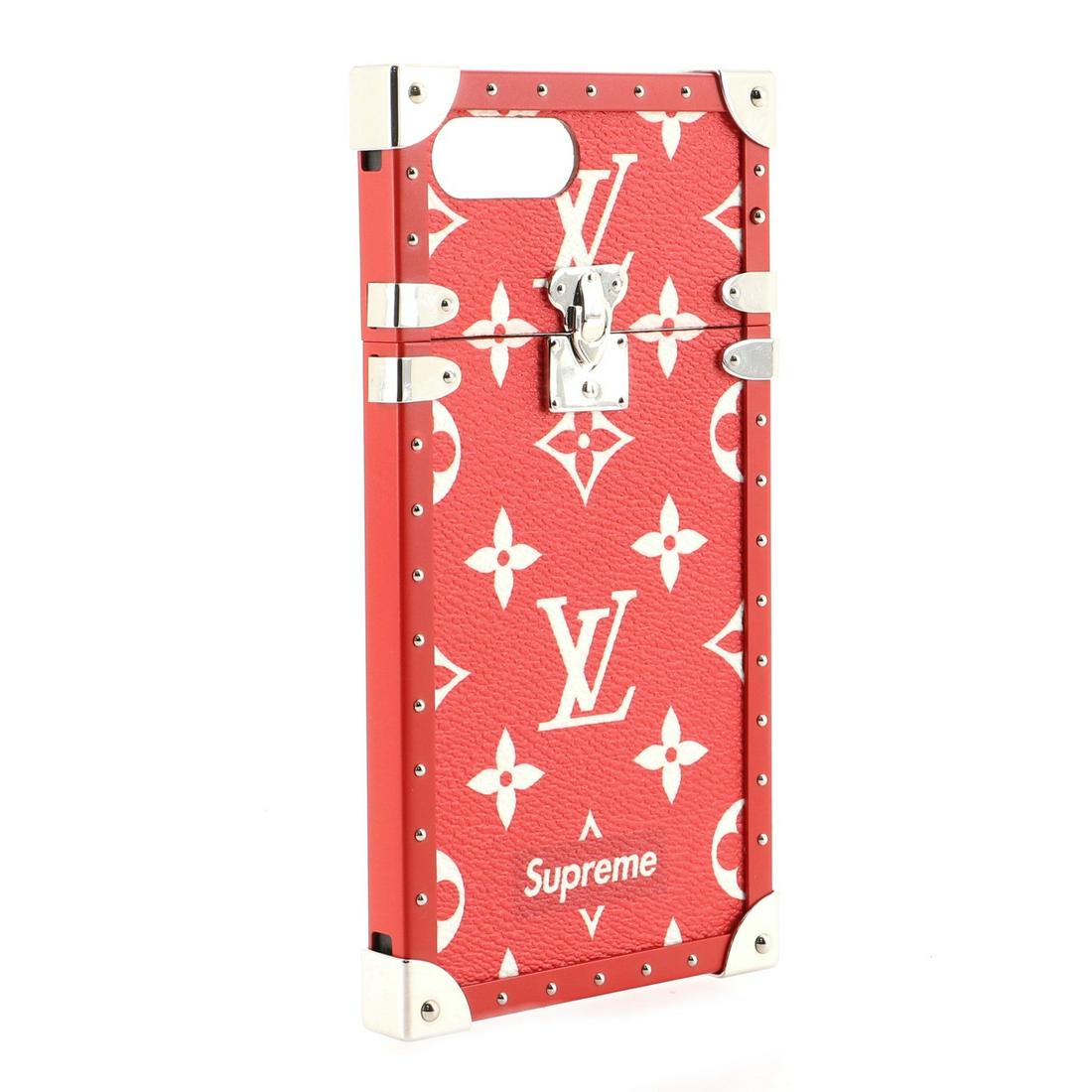 Louis Vuitton x Supreme Red Eye Trunk Monogram Canvas Limited Edition iPhone 7 Plus Phone Case: Louis Vuitton x Supreme Red Eye Trunk Monogram Canvas Limited Edition iPhone 7 Plus Phone Case The case holds an iPhone 7 perfectly with a red microfiber interior and has shiny golden color metal piec