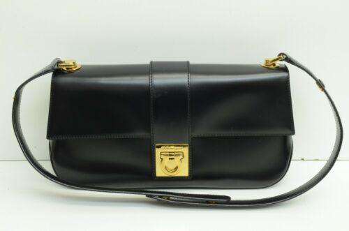 Salvatore Ferragamo Gancini Logo Purse GP Fold Lock Black Leather: Salvatore Ferragamo Gancini Logo Purse GP Fold Lock Black Leather Size: Medium Character: Gancini Accents: Strap Buttons Logo Model: Salvatore Ferragamo Gancini Country/Region of Manufacture: Italy De