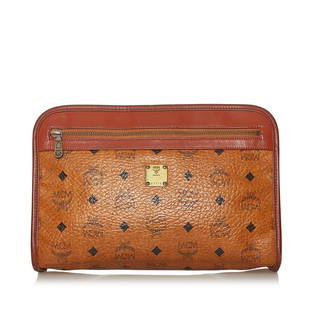 MCM Visetos Leather Pouch: MCM Visetos Leather Pouch This pouch features a leather body an exterior zip pocket and top zip closure. Brand: MCM Model: Visetos Leather Pouch Origin: Germany Category: SLG Color: Brown Style: