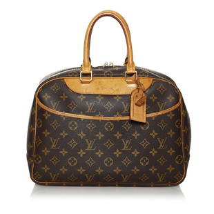 Louis Vuitton Monogram Deauville: Louis Vuitton Monogram Deauville The Deauville features a monogram canvas body rolled leather handles an exterior slip pocket a top zip closure and interior open pockets. Brand: Louis Vuitton
