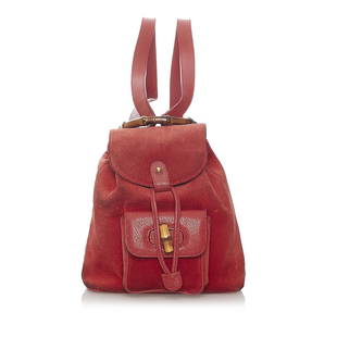 Gucci Bamboo Suede Backpack: Gucci Bamboo Suede Backpack This backpack features a suede body with leather trim an exterior front flap pocket with bamboo twist lock closure flat leather back straps a bamboo top handle top