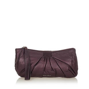 Miu Miu Leather Clutch Bag: Miu Miu Leather Clutch Bag This clutch bag features a leather body a top zip closure and an interior zip pocket. Brand: Miu Miu Model: Leather Clutch Bag Origin: Italy Category: Bags Color: