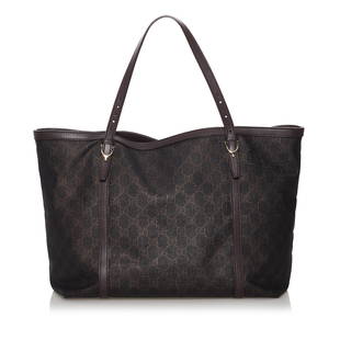 Gucci GG Canvas Joy Tote Bag: Gucci GG Canvas Joy Tote Bag This tote bag features a canvas body with leather trim flat leather handles an open top with a magnetic snap button closure and an interior slip pocket. Brand: Gucci