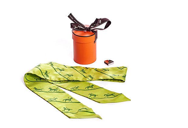 Hermes Lime Green Horses Twilly Scarf: Hermes Lime Green Horses Twilly Scarf Condition: Very Good; minor wear Era: Contemporary; 2000s Dimensions: 34" L x 2" W Materials: silk metal Color: lime green palladium Hermes twilly silk scarf with