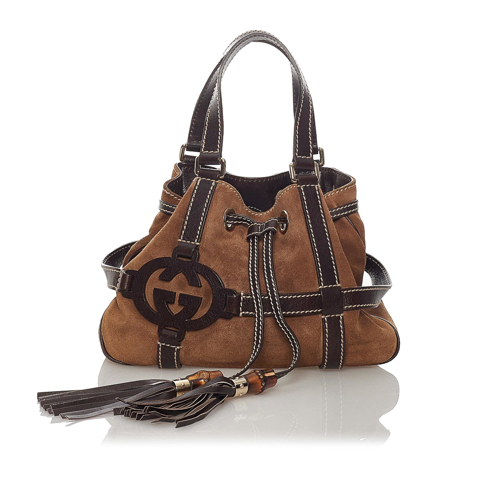 Gucci Suede Handbag: Gucci Suede Handbag This handbag features a suede body with leather trim flat leather handles an open top with drawstring and tassel closure and interior zip and slip pockets. Brand: Gucci Model: Sued