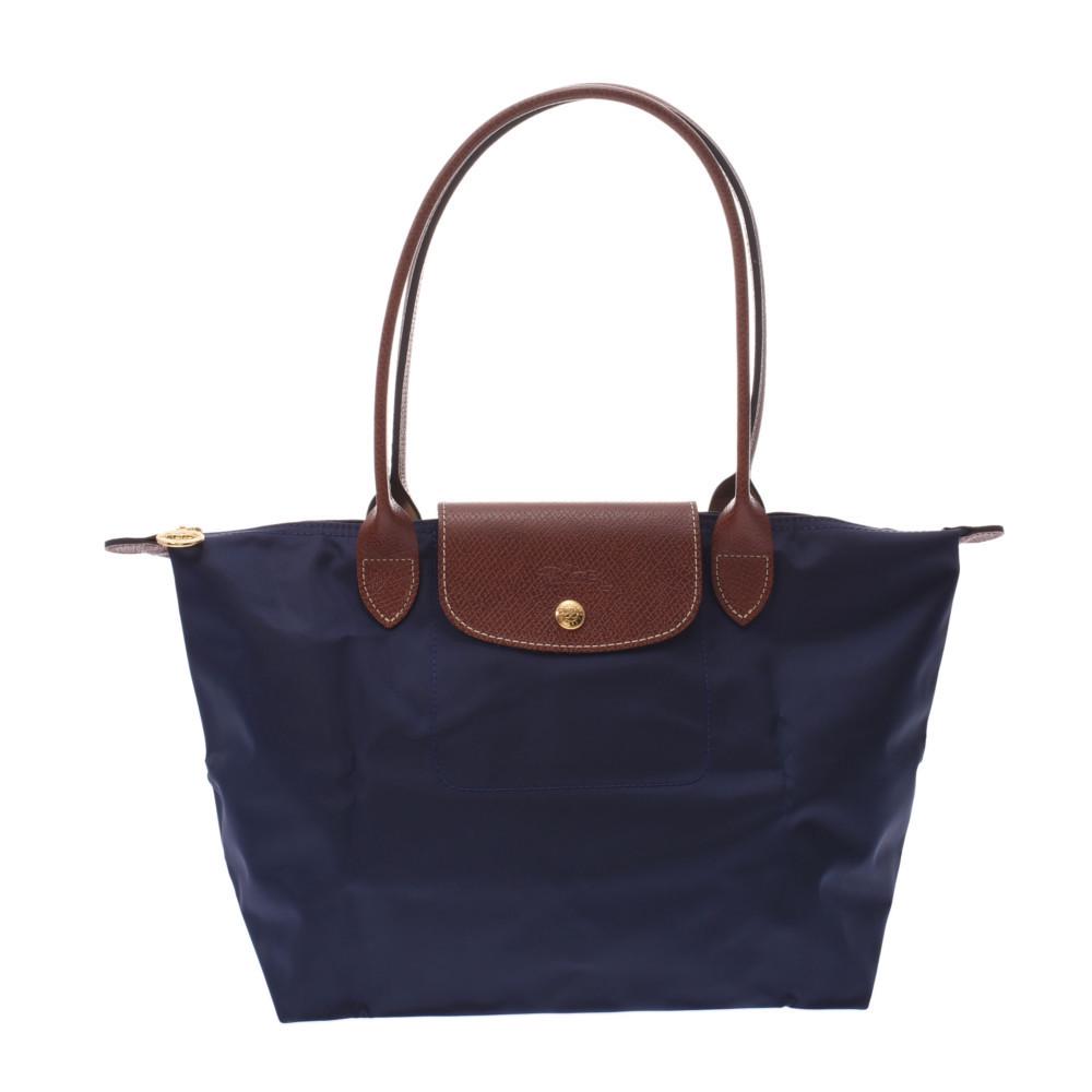 LONGCHAMP Long S Navy / Brown L2605089556 Women's Nylon Leather Tote Bag: LONGCHAMP Long S Navy / Brown L2605089556 Women's Nylon Leather Tote Bag Brand: Longchamp Line: Le Pliage Type: Tote bag Gender: Men Women Material: Nylon Leather Nylon: Leather: Color: Brown Navy Har