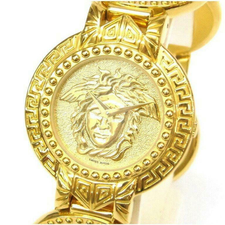 Gianni Versace Medusa Coin Belt Gold Quartz Gold Plated Ladies Watch: Gianni Versace Medusa Coin Belt Gold Quartz Gold Plated Ladies Watch Brand: Gianni Versace Type: Wristwatch Department: Ladies Pre-Owned The BIDHAUS Guarantee: All items in this auction are guaranteed