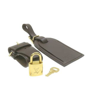 LOUIS VUITTON Leather Name Tag Powanie Padlock Set Brown LV: LOUIS VUITTON Leather Name Tag Powanie Padlock Set Brown LV Brand: LOUIS VUITTON Country/Region of Manufacture: France Type: unknown Color: unknown Department: Woman AB: Very Good The BIDHAUS