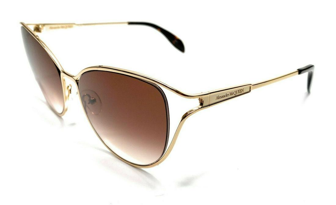 Alexander McQueen AM0194S 002 Gold Women's Sunglasses 58: Alexander McQueen AM0194S 002 Gold Women's Sunglasses 58 Lens Material: Plastic Country/Region Of Manufacture: Italy Department: Women Style: Cat Eye Temple Length: 135 mm Theme: Metal Lens Technology