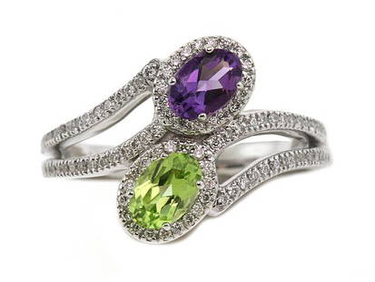 Peridot & Amethyst Oval Halo Duo Ring With Pave Split Shank In 14k White Gold (6x4mm): Peridot & Amethyst Oval Halo Duo Ring With Pave Split Shank In 14k White Gold (6x4mm) Trendy Oval Halo Duo Gemstone Ring With 6x4mm Amethyst And Peridot Is Accented By 0.33ctw Of Round Brilliant