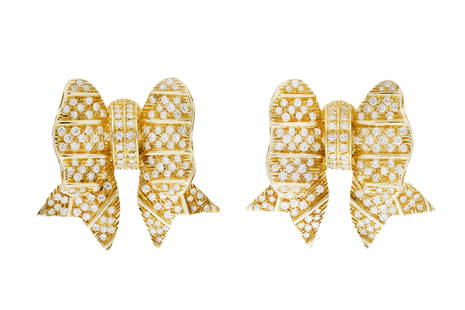 Gold and Diamond Bow Earrings: Gold and Diamond Bow Earrings Finely crafted in 18k yellow gold with round brilliant cut diamonds weighing approximately a total of 4.50 carats.Circa 1970s-1980s The BIDHAUS Guarantee: All items