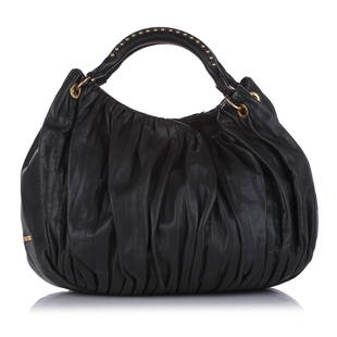 Miu Miu Leather Shoulder Bag: Miu Miu Leather Shoulder Bag This shoulder bag features a leather body rolled straps a top zip closure and an interior zip pocket. Brand: Miu Miu Model: Leather Shoulder Bag Origin: FRANCE