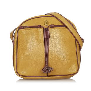 Must de Cartier Leather Crossbody Bag: Must de Cartier Leather Crossbody Bag This crossbody bag features a leather body an adjustable flat shoulder strap an exterior front open pocket a drawstring detail with a tassel pull a top zip