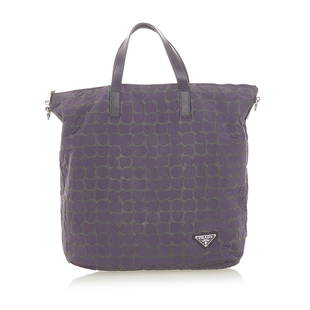 Prada Tessuto Stampato Tote Bag: Prada Tessuto Stampato Tote Bag This tote bag features a printed nylon body flat leather straps a top zip closure and an interior slip pocket. Brand: Prada Model: Tessuto Stampato Tote Bag