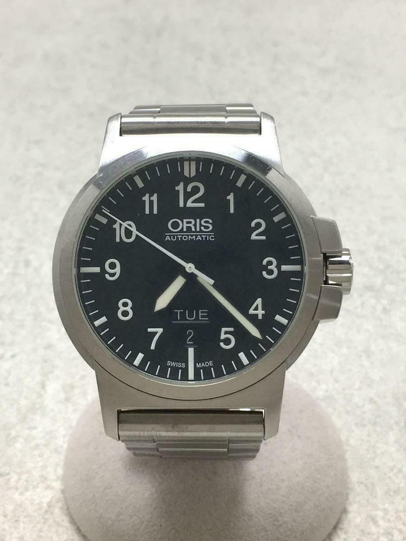 ORIS Self-winding Analog Stainless Steel Black Silver Mens Watch Pre Owned: ORIS Self-winding Analog Stainless Steel Black Silver Mens Watch Pre Owned Brand: Oris Type: Wristwatch Department: Mens Pre-Owned The BIDHAUS Guarantee: All items in this auction are guaranteed authe