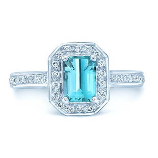 Blue Topaz And Diamond Ring In 14k White Gold: Blue Topaz And Diamond Ring In 14k White Gold This Stunning Gemstone Ring Features An Emerald Cut Blue Topaz Surrounded By Round Brilliant Diamonds Weighing 1/4ctw Set In 14 Karat White Gold 14