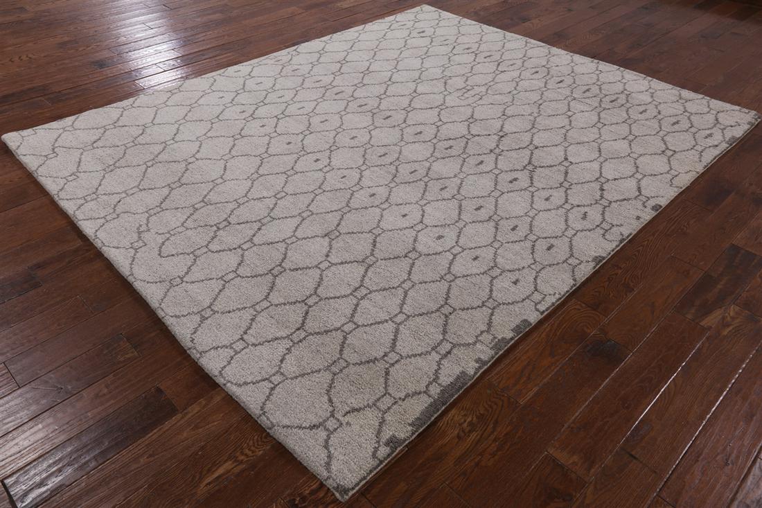 7' 8" X 9' 6" Hand Knotted Wool Moroccan Area Rug: 7' 8" X 9' 6" Hand Knotted Wool Moroccan Area Rug Design: Geometric Exact Size: 7\ 8 X 9\ 6 Style: Moroccan Foundation: Cotton Pile: Wool Weave: Hand-knotted Age: New The BIDHAUS Guarantee: All items