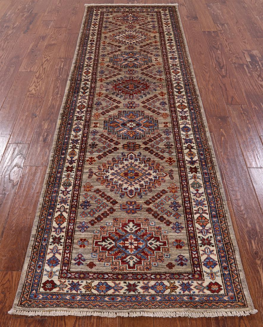 2' 10" X 9' 3" Runner Super Kazak Handmade Rug: 2' 10" X 9' 3" Runner Super Kazak Handmade Rug Design: Traditional Exact Size: 2\ 10 X 9\ 3 Style: Super Kazak Foundation: Cotton Pile: Wool Weave: Hand-knotted Age: New The BIDHAUS Guarantee: All ite