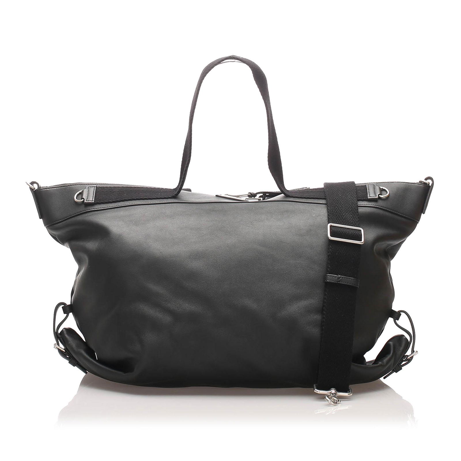 YSL Leather Travel Bag: YSL Leather Travel Bag This travel bag features a leather body flat canvas handles a detachable flat leather strap a two way top zip closure and an interior zip pocket. Brand: YSL Model: Leather Trave