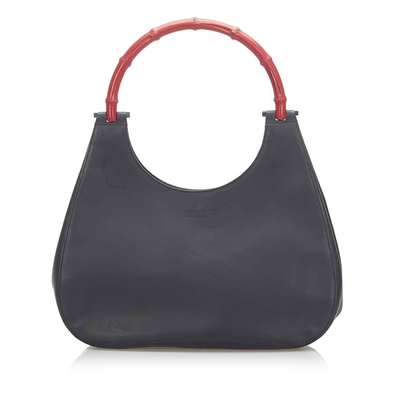 Gucci Bamboo Leather Handbag: Gucci Bamboo Leather Handbag This handbag features a leather body a bamboo top handle an open top with magnetic closure and an interior zip pocket. Brand: Gucci Model: Bamboo Leather Handbag Origin: I