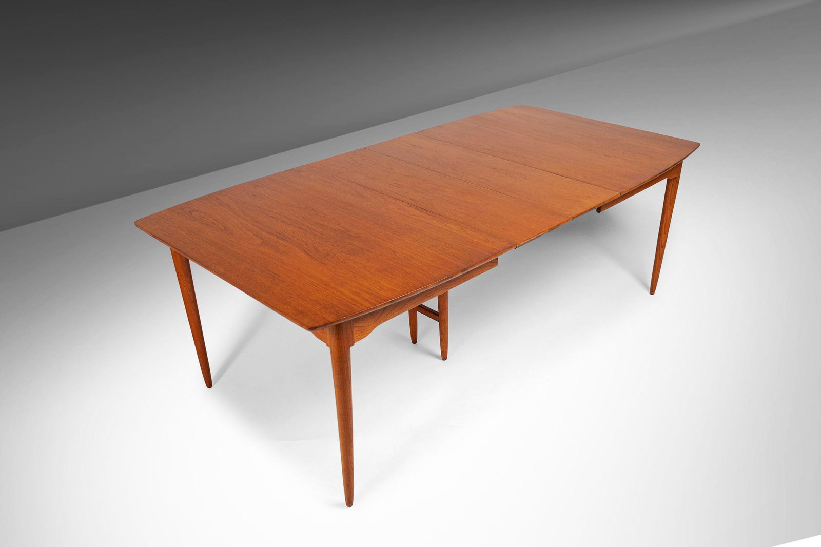 Mid Century Modern Expandable Dining Table in the Manner of Arne Vodder c. 1960's (Seat Up to 10): Mid Century Modern Expandable Dining Table in the Manner of Arne Vodder c. 1960's (Seat Up to 10) About: Simultaneously understated and elegant this beautiful extension dining table proves that Americ