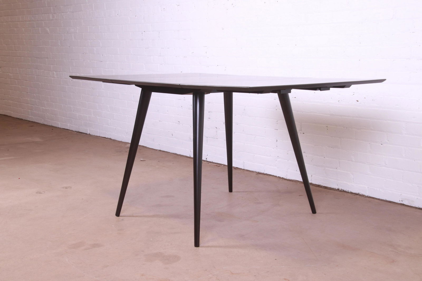 Paul McCobb Planner Group Black Lacquered Solid Maple Drop Leaf Dining Table Newly Refinished: Paul McCobb Planner Group Black Lacquered Solid Maple Drop Leaf Dining Table Newly Refinished An exceptional mid-century modern black lacquered solid maple drop-leaf dining table By Paul McCobb for Wi