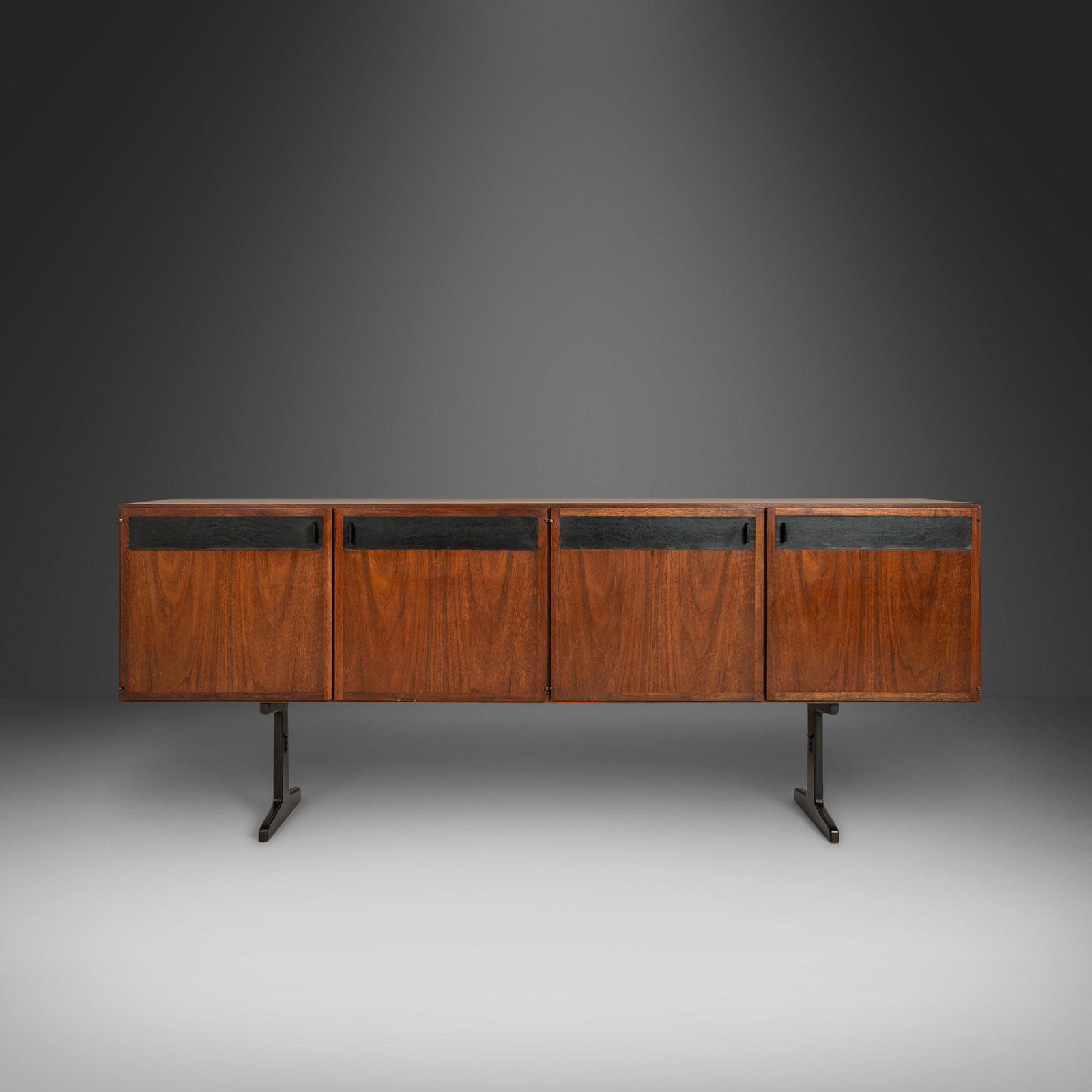 Mid Century Modern Credenza / Media Console by Jack Cartwright for Founders in Walnut and Original: Mid Century Modern Credenza / Media Console by Jack Cartwright for Founders in Walnut and Original Black Leatherette USA c. 1960's About: An exceptional design with attention to every detail. Designed