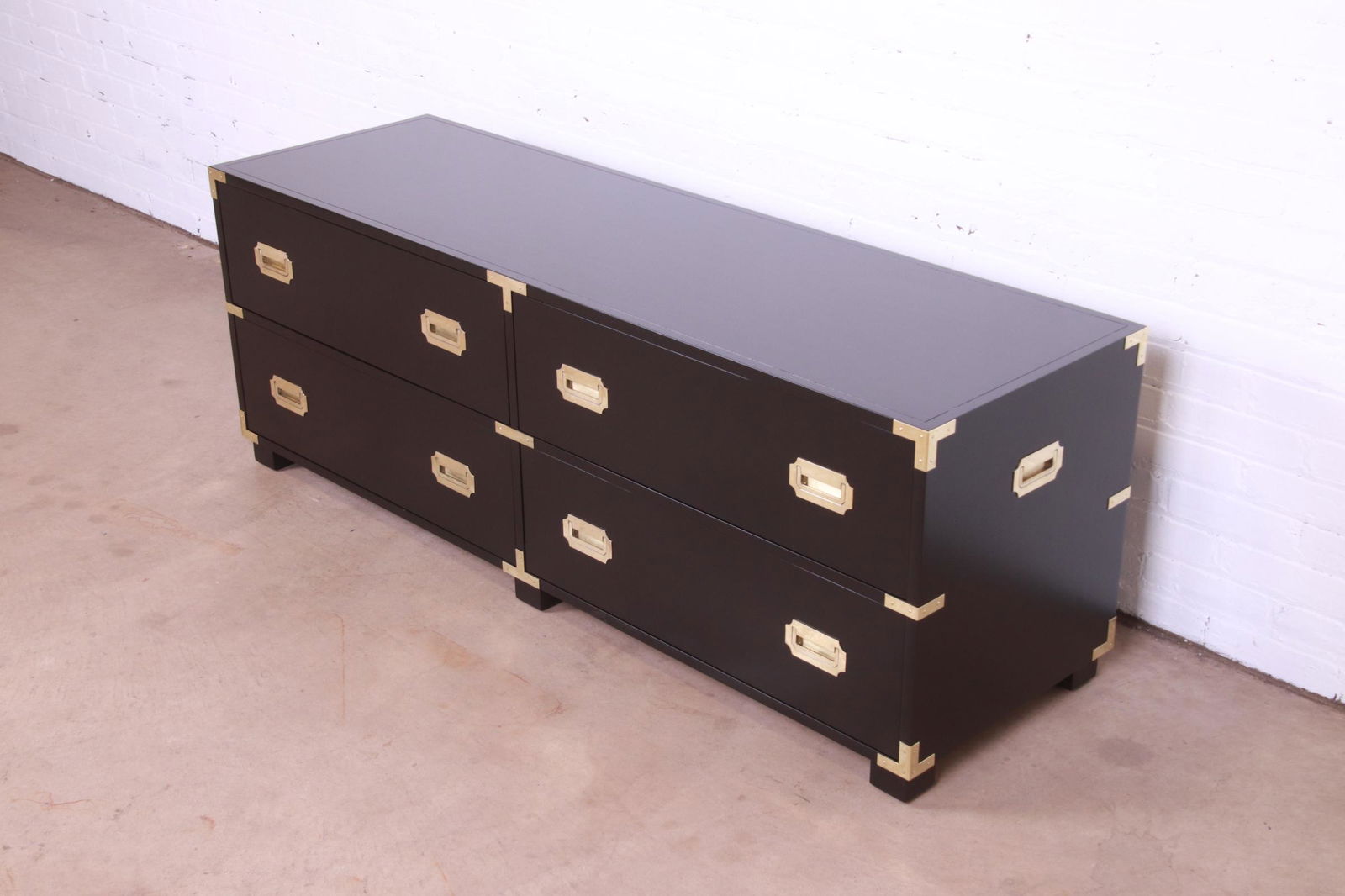 Michael Taylor for Baker Furniture Hollywood Regency Black Lacquered Campaign Dresser Chest Newly: Michael Taylor for Baker Furniture Hollywood Regency Black Lacquered Campaign Dresser Chest Newly Refinished An exceptional mid-century modern Hollywood Regency Campaign style four-drawer lowboy dress