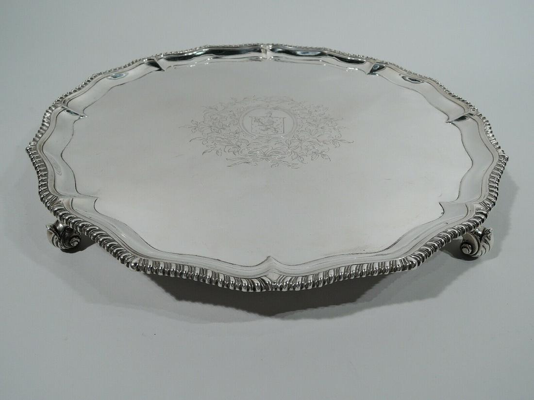 George III Salver - Antique Georgian Tray - English Sterling Silver - Rew 1769: George III Salver - Antique Georgian Tray - English Sterling Silver - Rew 1769 George III sterling silver salver. Made by Robert Rew in London in 1769. Round and ogee well with engraved armorial in fl