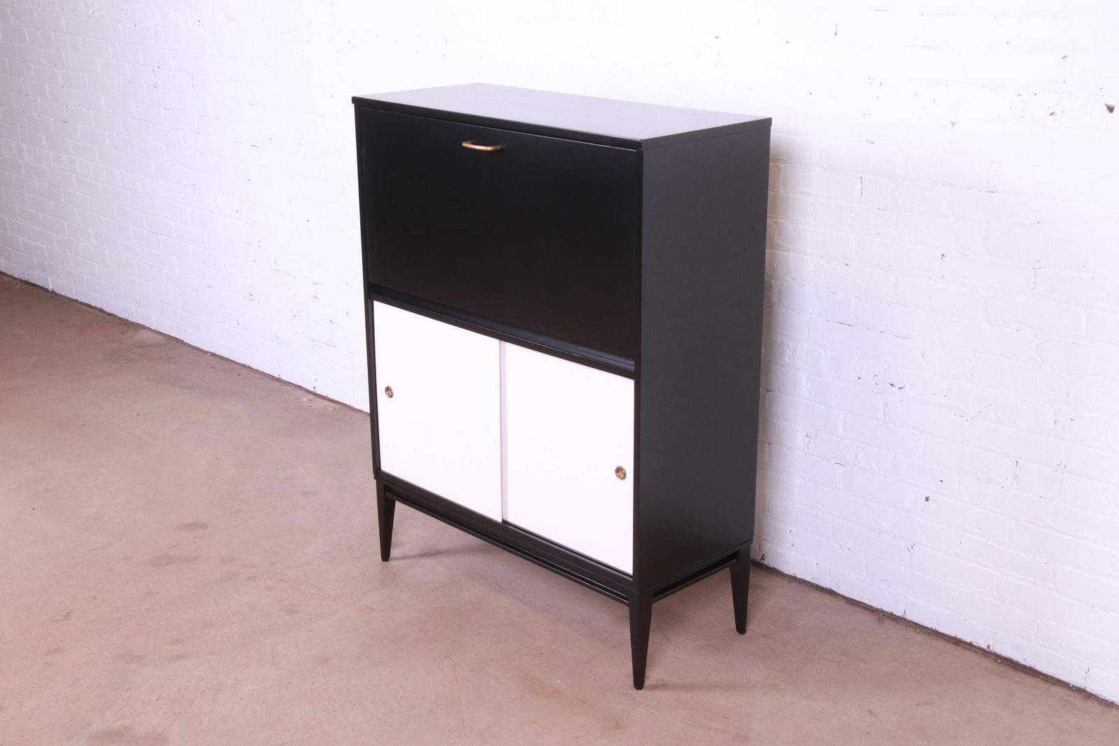 Paul McCobb Planner Group Drop Front Desk With Sliding Door Credenza Newly Refinished: Paul McCobb Planner Group Drop Front Desk With Sliding Door Credenza Newly Refinished A rare and exceptional mid-century modern drop front secretary desk cabinet with a lower sliding door credenza By