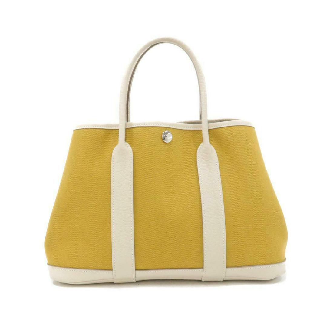 HERMES Garden Party 30cm 066606CK: HERMES Garden Party 30cm 066606CK Brand: HERMES Style: Tote Bag Exterior Color: CURCUMA+CRAIE SILVER Metal Parts Exterior Material: Toile Chevrons + Country Gender: Ladies Size: WxHxD : 30cm x 21cm x