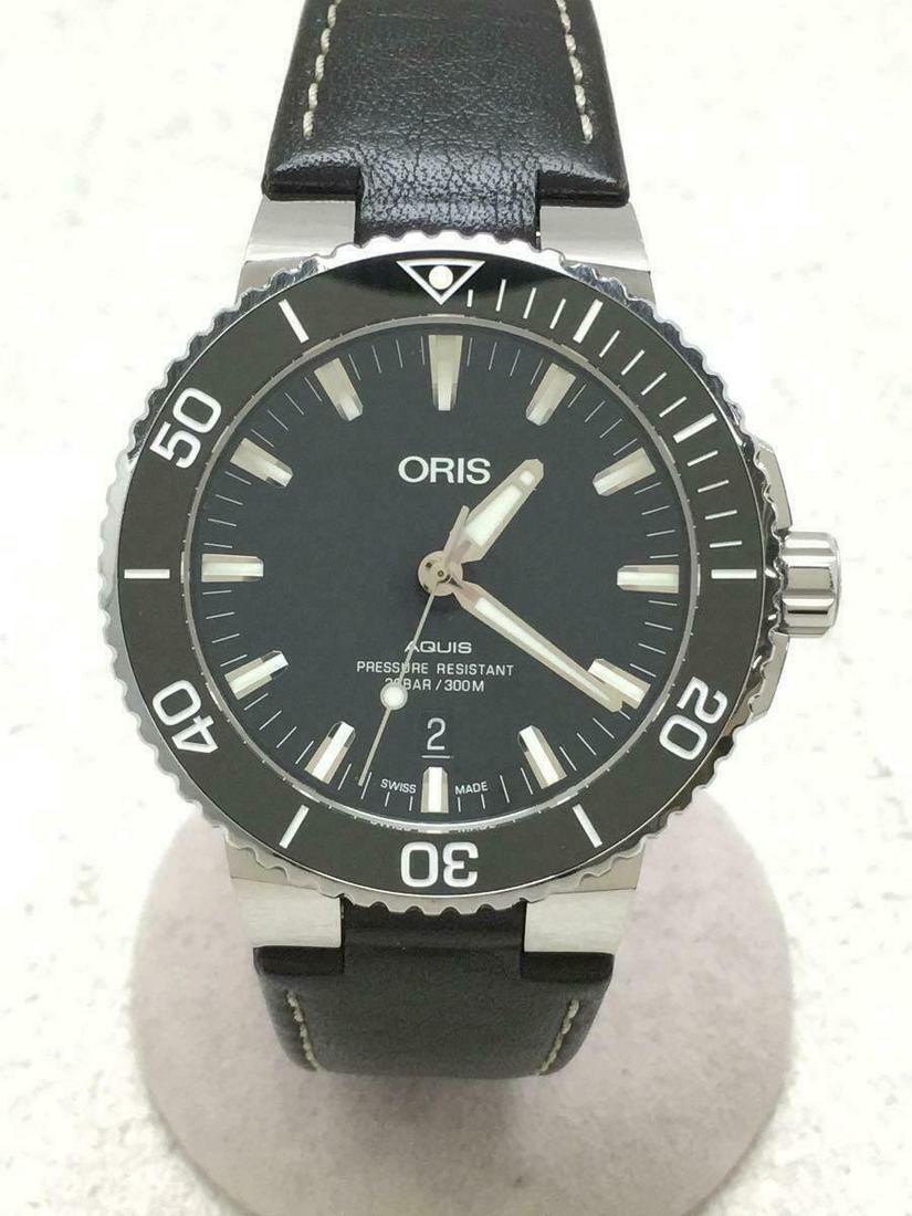 ORIS Self-winding Aquis Date Analog Leather Black Stainless Men's Watch: ORIS Self-winding Aquis Date Analog Leather Black Stainless Men's Watch Brand: Oris Type: Wristwatch Pre-Owned The BIDHAUS Guarantee: All items in this auction are guaranteed authentic and come with a