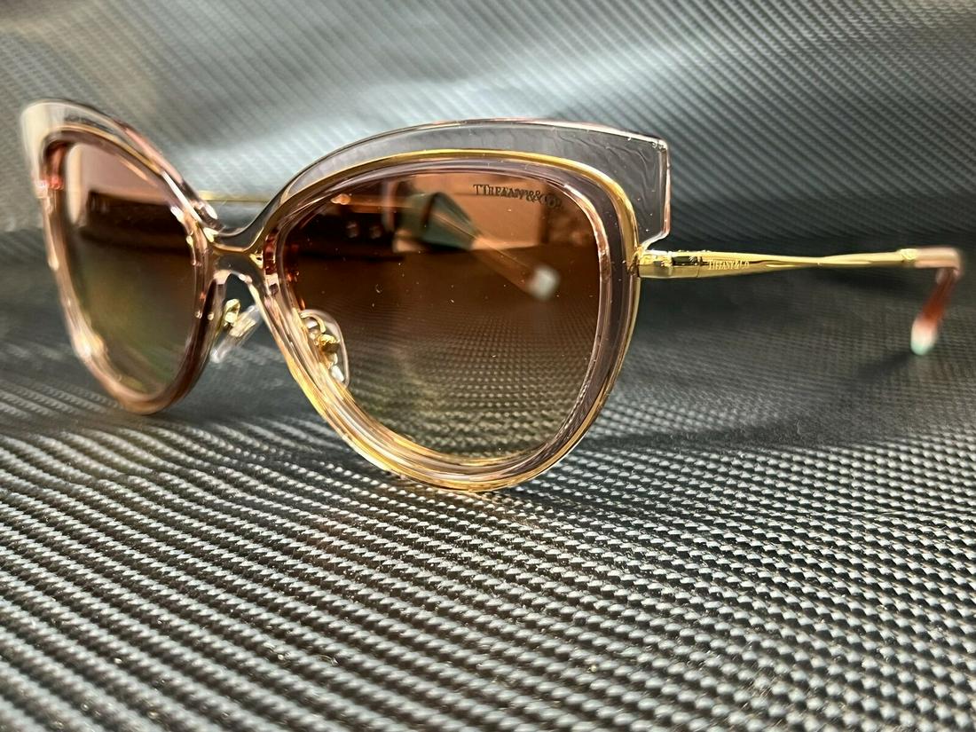 TIFFANY TF3076 83263N Warm Pink Cat Eye Women's 57 mm: TIFFANY TF3076 83263N Warm Pink Cat Eye Women's 57 mm Brand: Tiffany & Co. Type: Sunglasses Frame Color: Pink Department: Women Style: Cat Eye New The BIDHAUS Guarantee: All items in this auction are 