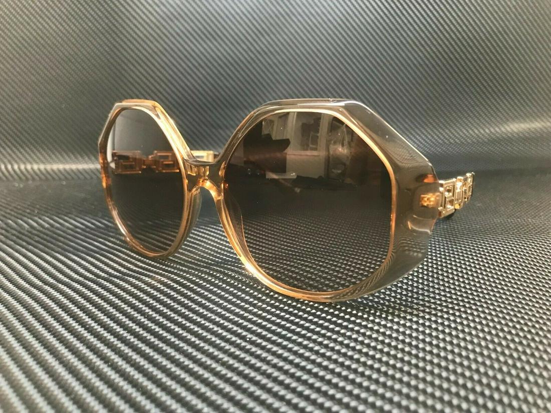 VERSACE VE4395 533313 Transparent Brown Square Women's 59 mm: VERSACE VE4395 533313 Transparent Brown Square Women's 59 mm Department: Women Style: Square Type: Sunglasses Brand: Versace Frame Color: Brown New The BIDHAUS Guarantee: All items in this auction are