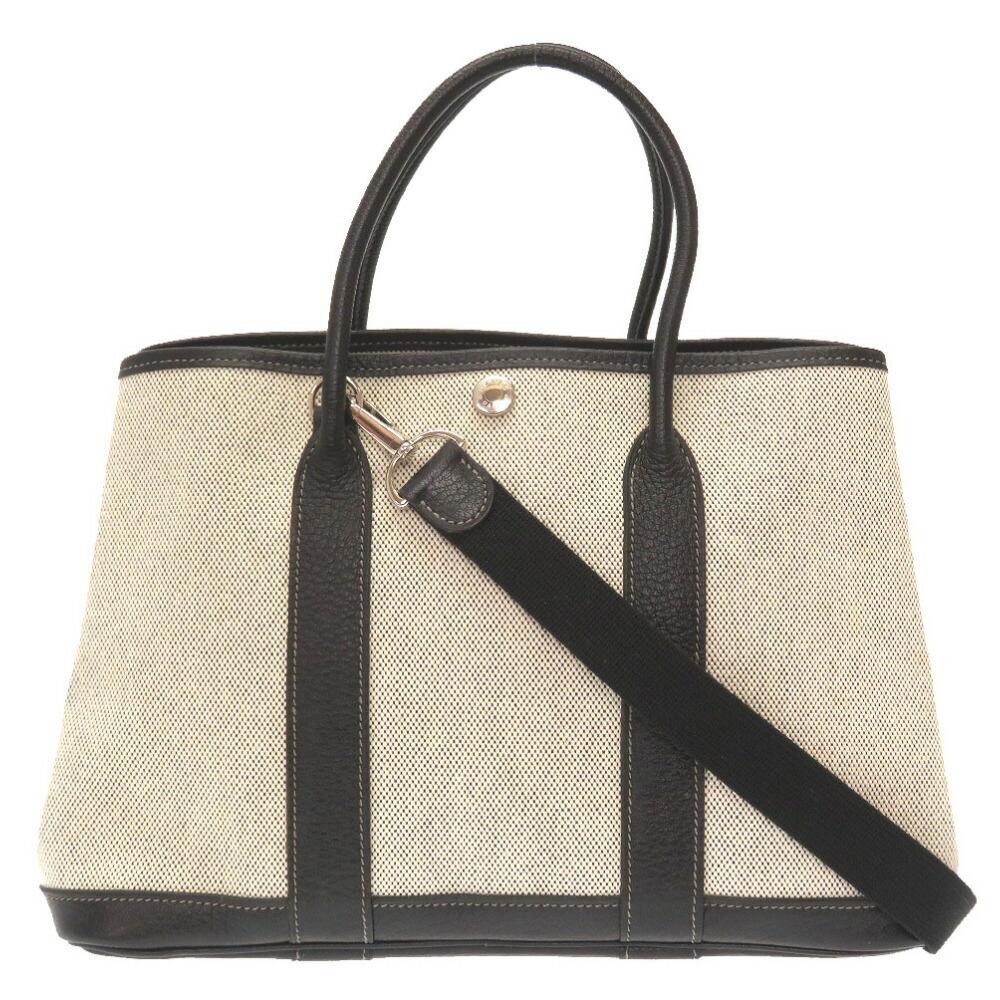 Hermes Garden Party TPM Toile Ash Black # J Engraved 2WAY Handbag Bag 0073 HERMES: Hermes Garden Party TPM Toile Ash Black # J Engraved 2WAY Handbag Bag 0073 HERMES Brand: Hermes Line: Garden Country of Origin: France Type: Handbag Gender: Women Material: Toile H Toile H: Color: Bla