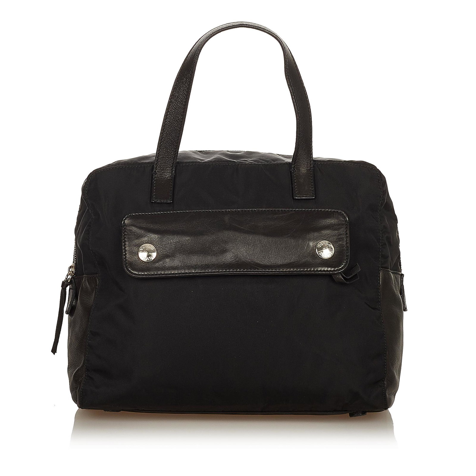 Prada Tessuto Business Bag: Prada Tessuto Business Bag This business bag features a nylon body with leather trim flat handles exterior zip and slip compartments a top zip closure and interior zip and slip pockets. Brand: Prada M