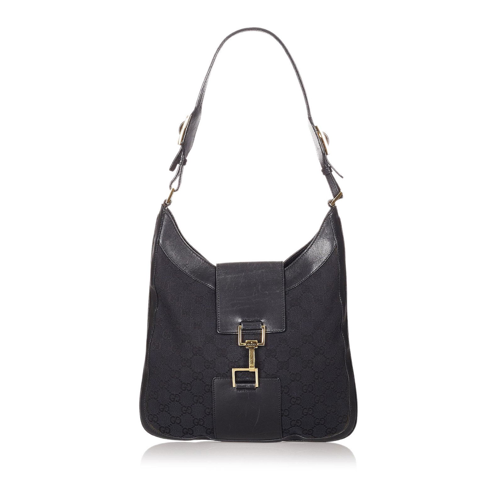 Gucci GG Canvas Shoulder Bag: Gucci GG Canvas Shoulder Bag This shoulder bag features a canvas body with leather trim a flat strap a top flap closure and an interior zip pocket. Brand: Gucci Model: GG Canvas Shoulder Bag Origin: I
