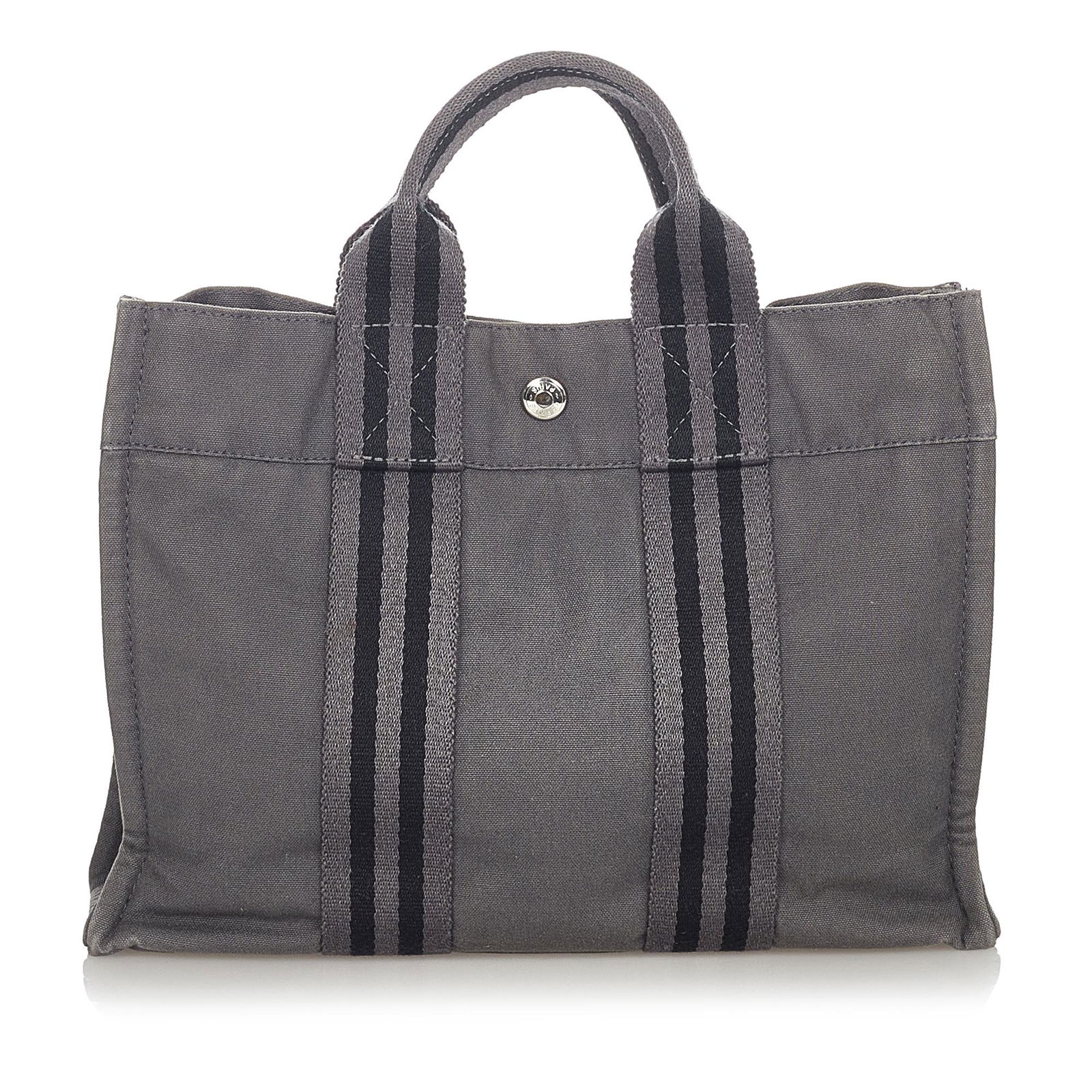 Hermes Fourre Tout PM: Hermes Fourre Tout PM The Fourre Tout PM features a canvas body flat handles an open top with magnetic snap closure and an interior zip pocket. Brand: Hermes Model: Fourre Tout PM Origin: France Categ