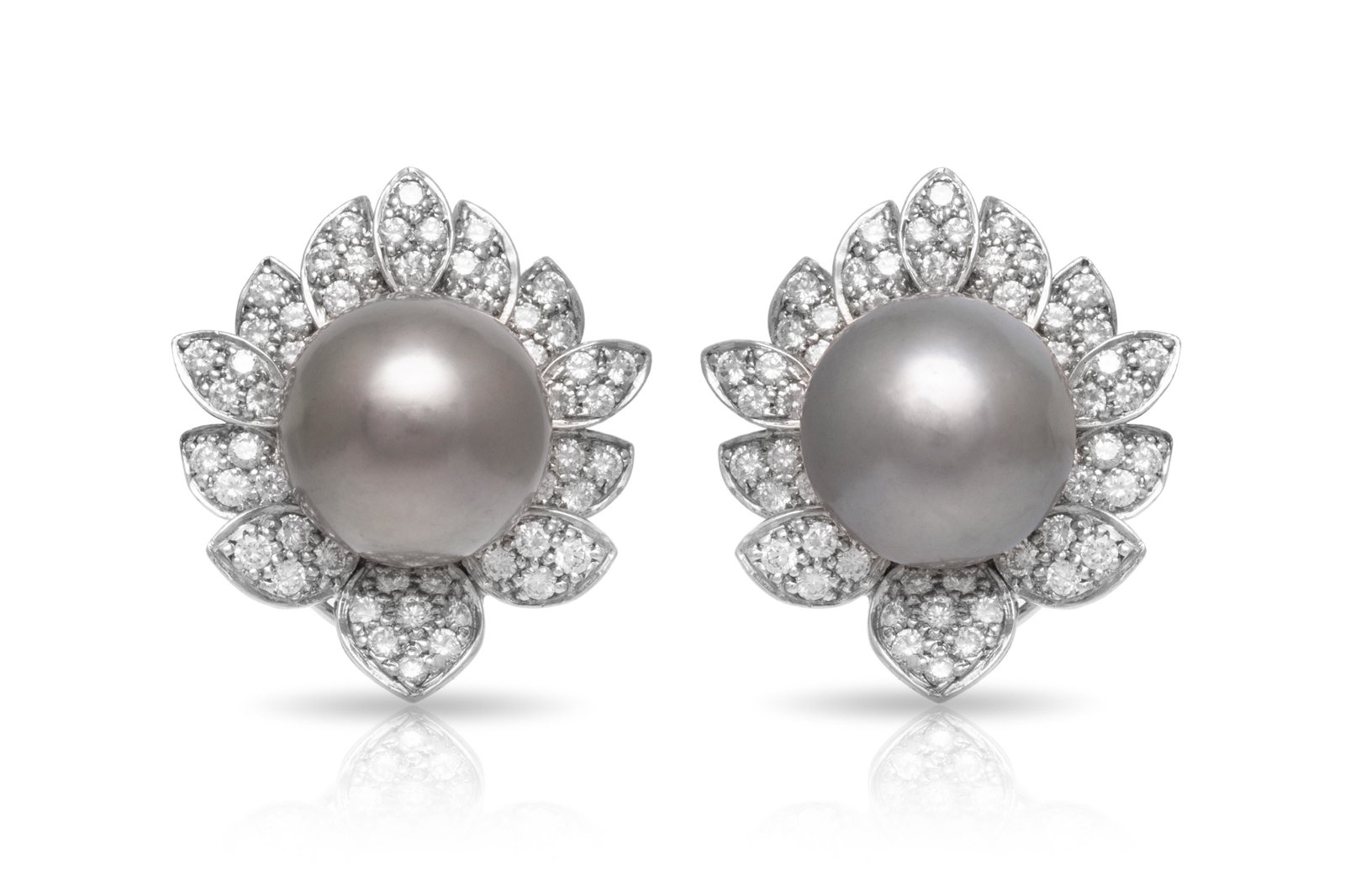 Black Pearl Diamond Flower Earrings: Black Pearl Diamond Flower Earrings Earrings in shape of flower finely crafted in platinum with black pearls in the middle and diamonds around weighing approximately a total of 3.04 carats. Circa 1990
