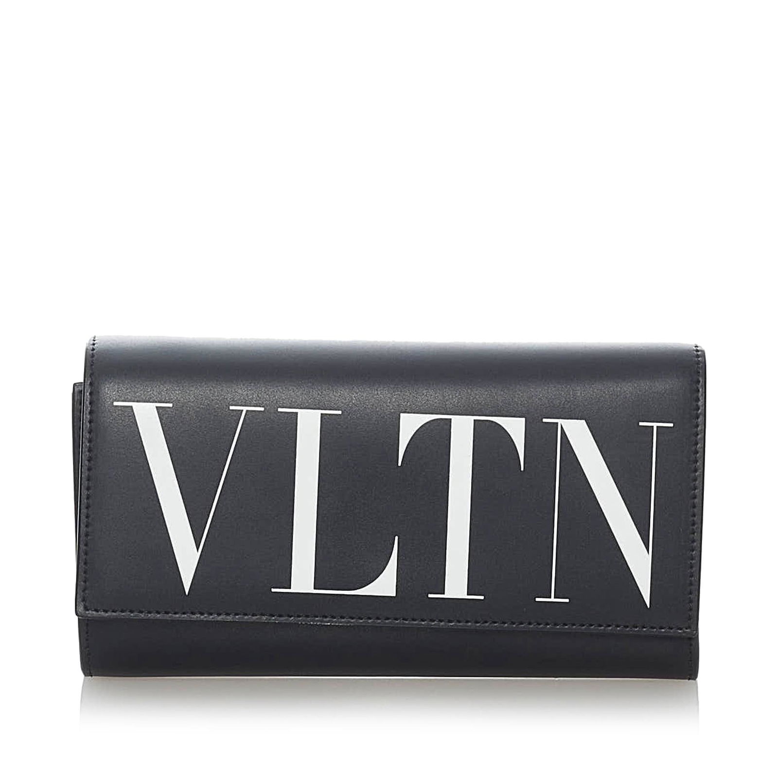 Valentino VLTN Leather Wallet on Strap: Valentino VLTN Leather Wallet on Strap This wallet on strap features a leather body a flat strap a front flap with snap closure and interior zip and slip compartments. Brand: Valentino Model: VLTN Lea