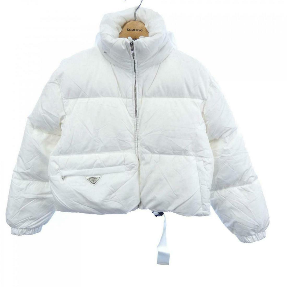 PRADA Down Jackets: PRADA Down Jackets Brand: PRADA Style: JACKET Color: White Gender: Ladies Size: 36 Size Type: Regular Type: JACKET B: Reasonable Wear and Tear The BIDHAUS Guarantee: All items in this auction are guar