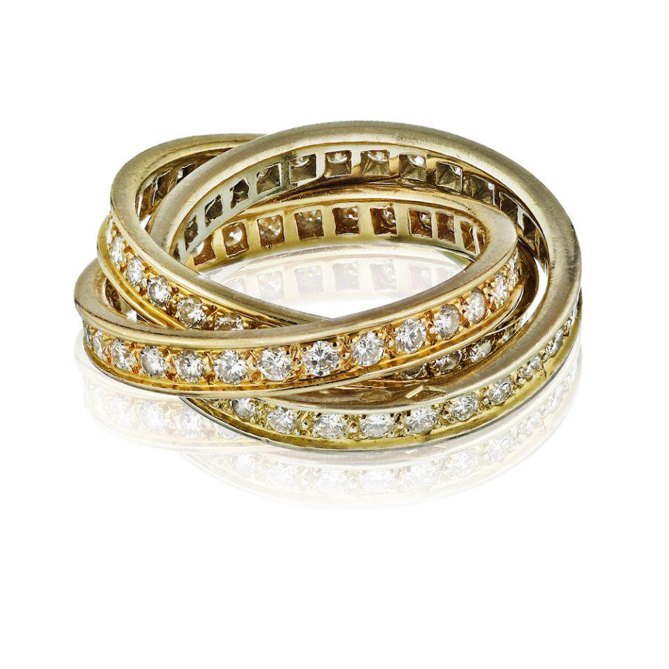 Cartier Trinity 18K Tri Color Diamond Ring: Cartier Trinity 18K Tri Color Diamond Ring Type: Estate Rings Metal: 18K Tri Color Grams: 8.1 Brand: Cartier Style: Trinity Other Details: METAL TYPE: 18K White Yellow and Rose GoldSTONE WEIGHT: 1.55 