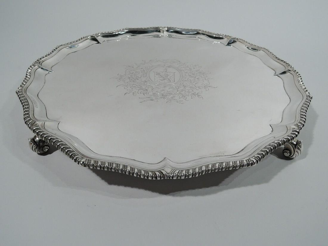 George III Salver - Antique Georgian Tray - English Sterling Silver - Rew 1769: George III Salver - Antique Georgian Tray - English Sterling Silver - Rew 1769 George III sterling silver salver. Made by Robert Rew in London in 1769. Round and ogee well with engraved armorial in fl