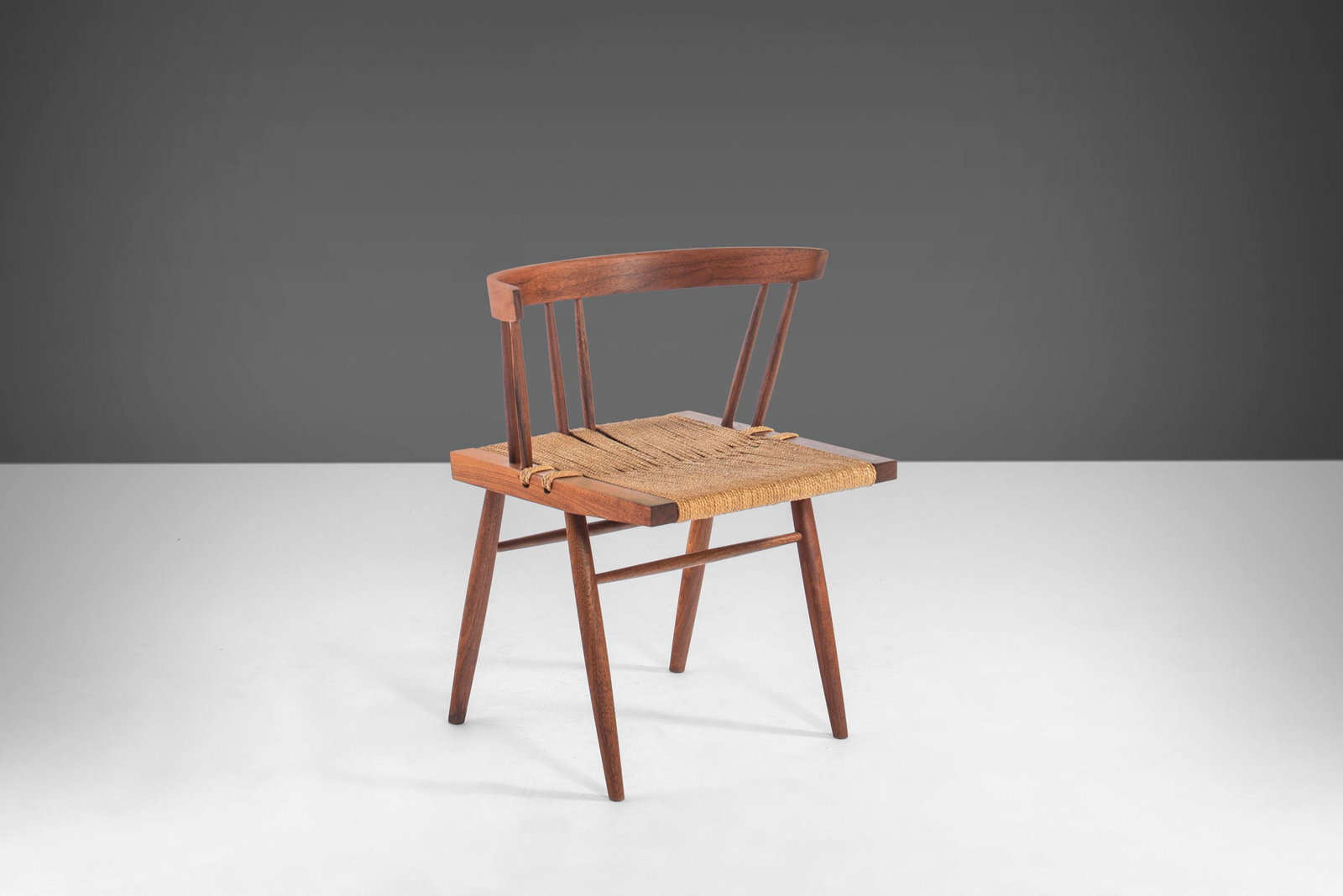 Early Grass Seat Chair by George Nakashima in Walnut c. 1940s: Early Grass Seat Chair by George Nakashima in Walnut c. 1940s About: Iconic rare and highly collectable. This early Grass Seat chair by George Nakashima was originally designed in the 1940s. A minimal