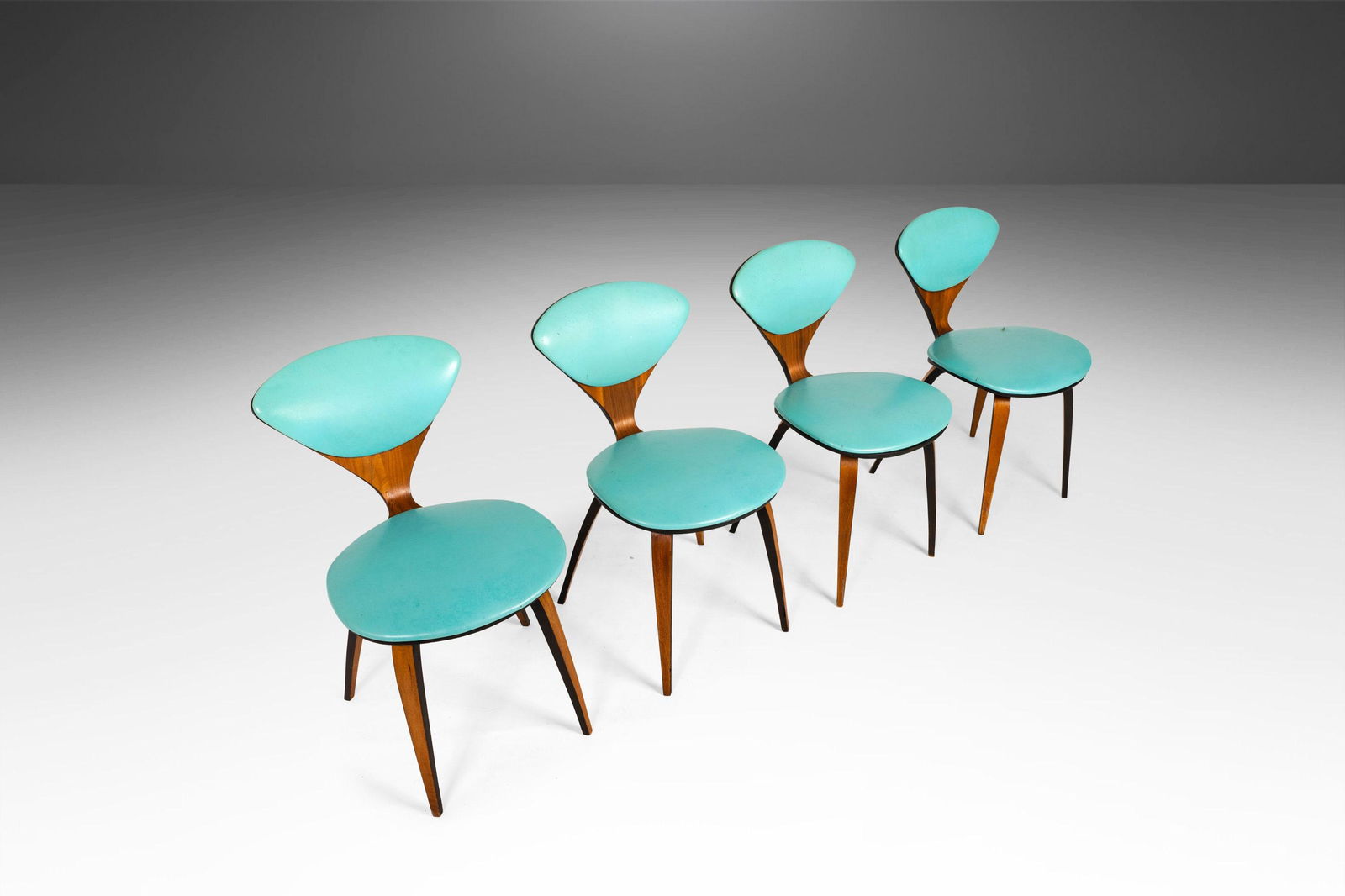 Set of Four (4) Dining Chairs by Norman Cherner for Plycraft in Teal Fabric USA c. 1964: Set of Four (4) Dining Chairs by Norman Cherner for Plycraft in Teal Fabric USA c. 1964 About: A pioneer both in molded plywood and prefab housing Norman Cherner studied and taught at the Columbia Uni